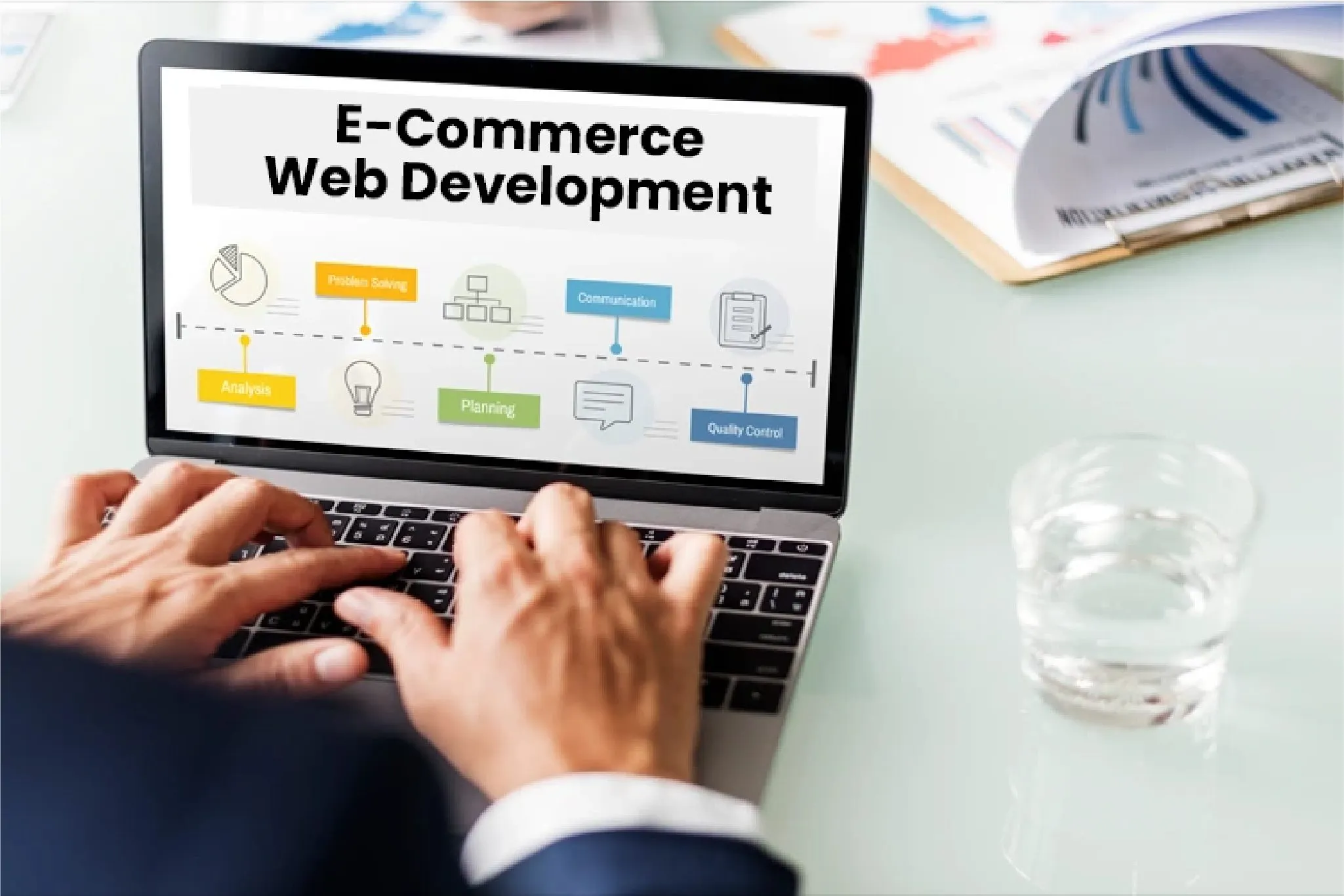 Person working on laptop displaying E-commerce Web Development process including analysis, planning, problem solving, communication, and quality control.