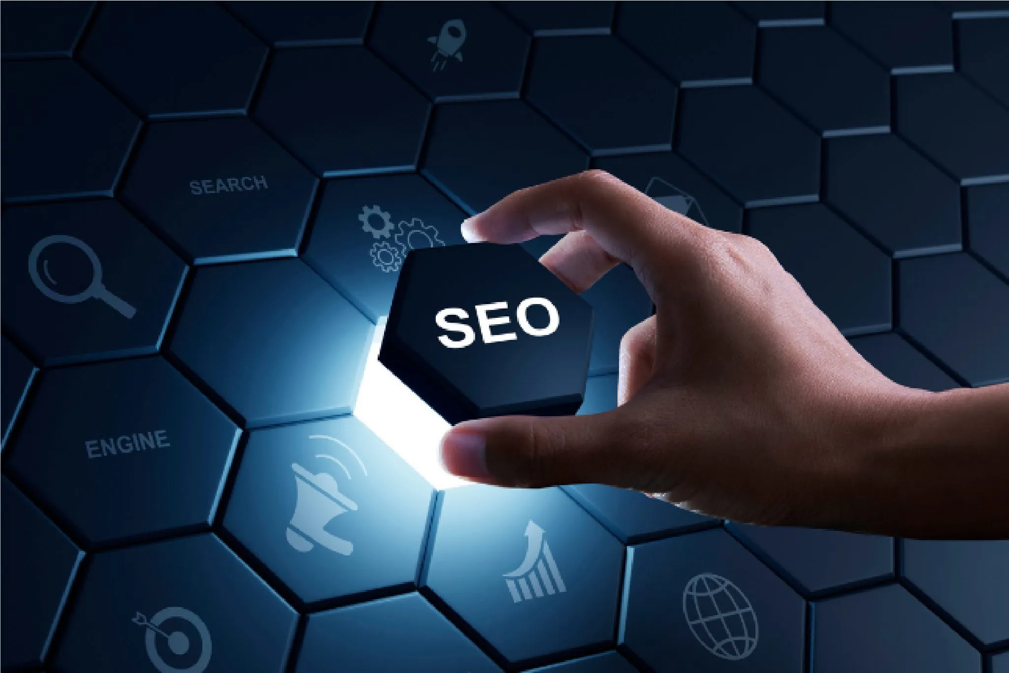 Hand holding a glowing hexagon block labeled SEO over a digital marketing and search engine optimization background.